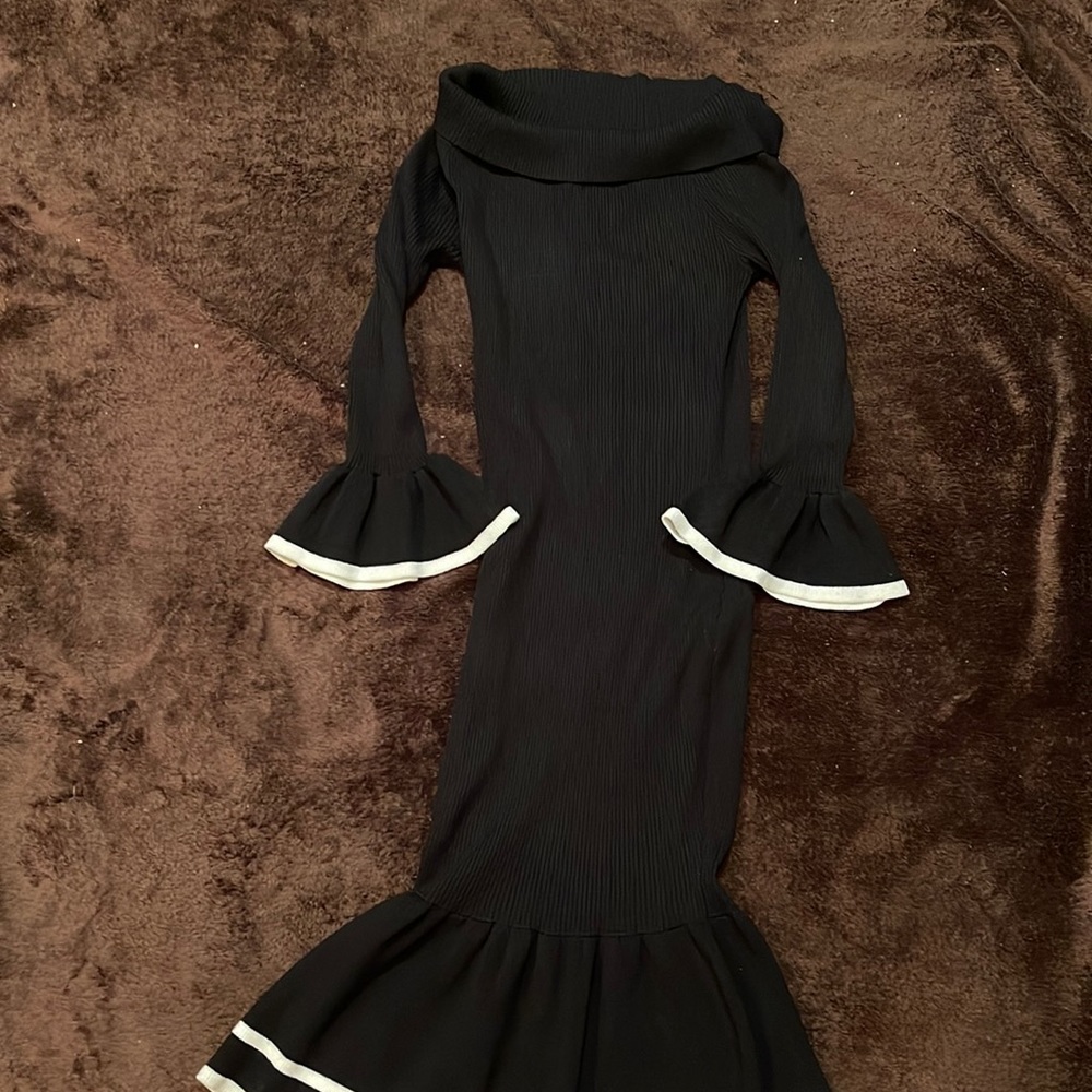 Black sweater turtleneck knit dress with white trim. Never worn size large.
